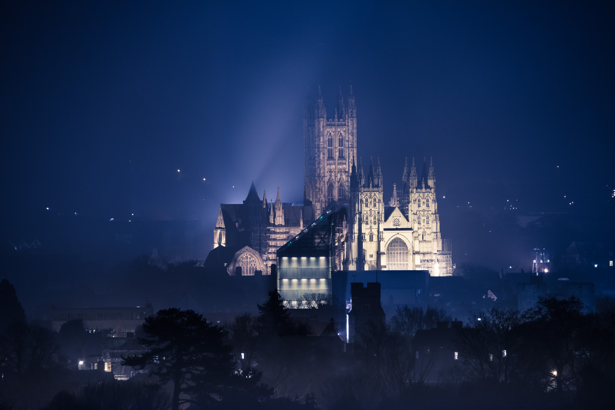 Canterbury Cathedral This image was taken from the north of the city on a cool winter's evening.  The building in front with a lot of lights on is the award winning Marlowe Theatre.